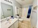 This bathroom has a shower-tub combo, single vanity, a toilet, and light colored walls at 6001 - 1045 S Kings Hwy., Myrtle Beach, SC 29575