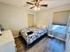 This bedroom features a queen bed, dresser, light colored walls, and wood-look floors at 6001 - 1045 S Kings Hwy., Myrtle Beach, SC 29575