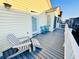 Outdoor deck with chairs, perfect for relaxing and enjoying the view at 6001 - 1045 S Kings Hwy., Myrtle Beach, SC 29575