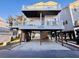 Charming raised beach house with spacious carport and dual balconies for relaxation at 6001 - 1045 S Kings Hwy., Myrtle Beach, SC 29575