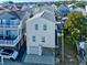 Charming coastal home with elevated living space and convenient ground-level garage at 6001 - 1045 S Kings Hwy., Myrtle Beach, SC 29575