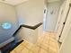 Upstairs hallway featuring ceramic tile, railing, and lighting at 6001 - 1045 S Kings Hwy., Myrtle Beach, SC 29575