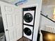 Convenient laundry closet with a stacked washer and dryer unit, maximizing space and efficiency at 6001 - 1045 S Kings Hwy., Myrtle Beach, SC 29575