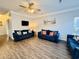 Spacious living room with hardwood floors, three sofas, and beach-themed decor at 6001 - 1045 S Kings Hwy., Myrtle Beach, SC 29575