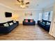 Living room featuring three plush sofas, perfect for relaxing and enjoying the beach-themed atmosphere at 6001 - 1045 S Kings Hwy., Myrtle Beach, SC 29575