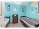 Cozy bedroom featuring light blue walls, twin beds, and comfortable furnishings at 815 Rogers Dr., Myrtle Beach, SC 29577