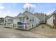 Charming light blue home with a white picket fence and front porch, offering curb appeal at 815 Rogers Dr., Myrtle Beach, SC 29577