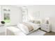 Bright bedroom with a white bed and access to the backyard at 882 Foxtail Dr. # C-38, Longs, SC 29568