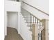 Modern staircase with wooden steps and black metal railing at 882 Foxtail Dr. # C-38, Longs, SC 29568