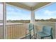 Inviting balcony showcasing seating with ocean and landscape views for relaxing outdoors at 9400 Shore Dr. # 312, Myrtle Beach, SC 29572