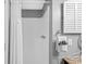 Bright, clean bathroom highlighting a white shower stall and tile with coordinated hardware at 9400 Shore Dr. # 312, Myrtle Beach, SC 29572