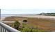 Beautiful ocean view featuring the beach and local foliage from a balcony at 9400 Shore Dr. # 312, Myrtle Beach, SC 29572
