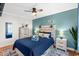 Well-appointed bedroom with bright walls, dresser and soft, cozy, blue bedding at 9400 Shore Dr. # 312, Myrtle Beach, SC 29572