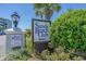 Welcoming Sands Beach Club Resort sign surrounded by lush landscaping and palm trees at 9400 Shore Dr. # 312, Myrtle Beach, SC 29572