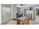 Comfortable living area with sofa, ceiling fan, and balcony access showcasing natural light at 9400 Shore Dr. # 312, Myrtle Beach, SC 29572