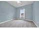 Cozy bedroom featuring neutral paint, carpet, and a large window for natural light, creating a serene retreat at 158 Regency Dr., Conway, SC 29526