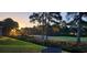 Beautiful view of the lush green golf course from the backyard with trees at sunset at 158 Regency Dr., Conway, SC 29526