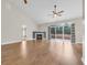 Spacious living room with a fireplace, ceiling fan, hardwood floors and sliding glass doors leading to the backyard at 158 Regency Dr., Conway, SC 29526