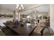 Formal dining room with a large table and access to the kitchen and living room at 2548 Brescia St., Myrtle Beach, SC 29579