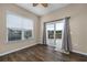 Sunroom with hardwood floors, window blinds, and access to backyard at 2548 Brescia St., Myrtle Beach, SC 29579