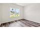 This bedroom features wood floors and a window with view of the outdoors at 332 Hayloft Circle, Conway, SC 29526