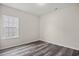 Bedroom with window and wood-look flooring at 332 Hayloft Circle, Conway, SC 29526
