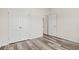 This bedroom has wood floors, a double door closet, and white doors and trim at 332 Hayloft Circle, Conway, SC 29526
