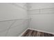 Walk-in closet with wire shelving and wood-look flooring at 332 Hayloft Circle, Conway, SC 29526
