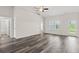 Bright, spacious living area with neutral paint, wood-look floors, and plenty of natural light at 332 Hayloft Circle, Conway, SC 29526