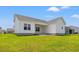 View of the rear of a home with a covered patio and ample yard space, perfect for outdoor enjoyment at 332 Hayloft Circle, Conway, SC 29526