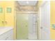 Modern bathroom with a tiled shower and a yellow color scheme at 624 Watercliff Dr., Longs, SC 29568