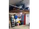 Garage with overhead storage, cabinets, and various items at 624 Watercliff Dr., Longs, SC 29568