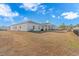 Exterior view of house, showcasing backyard and patio at 624 Watercliff Dr., Longs, SC 29568