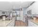 White kitchen cabinets and granite countertops at 624 Watercliff Dr., Longs, SC 29568