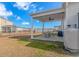 Covered patio with seating area overlooking pond at 624 Watercliff Dr., Longs, SC 29568