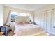 Bright bedroom with striped bedding and built-in closet at 1204 Erin Way # 1204-F, Myrtle Beach, SC 29577