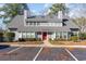 Two-story house with gray siding and red front door at 1204 Erin Way # 1204-F, Myrtle Beach, SC 29577