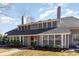 Two-story house with gray siding, red door, and bay window at 1204 Erin Way # 1204-F, Myrtle Beach, SC 29577