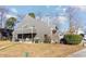 Gray house with backyard patio and mature trees at 1204 Erin Way # 1204-F, Myrtle Beach, SC 29577