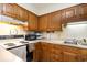 Kitchen with wood cabinets and appliances at 1204 Erin Way # 1204-F, Myrtle Beach, SC 29577