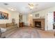 Living room with fireplace and kitchen view at 1204 Erin Way # 1204-F, Myrtle Beach, SC 29577