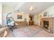 Living room with fireplace and kitchen view at 1204 Erin Way # 1204-F, Myrtle Beach, SC 29577