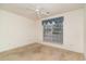 Well-lit bedroom with ceiling fan and large window at 1228 Lanterns Rest Rd., Myrtle Beach, SC 29579