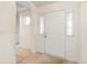 Bright entryway with white door and arched hallway at 1228 Lanterns Rest Rd., Myrtle Beach, SC 29579
