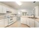View of kitchen with white cabinets and range at 1228 Lanterns Rest Rd., Myrtle Beach, SC 29579