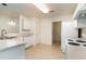 Kitchen features white cabinets, appliances, and tile floor at 1228 Lanterns Rest Rd., Myrtle Beach, SC 29579