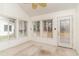 Sunroom features multiple windows, ceiling fan, and access to yard at 1228 Lanterns Rest Rd., Myrtle Beach, SC 29579