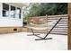 Relaxing patio with a hammock for lounging and a wooden privacy fence at 272 Old Ashley Loop, Pawleys Island, SC 29585