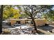 Outdoor patio with seating area, string lights, and large shade tree at 272 Old Ashley Loop, Pawleys Island, SC 29585