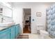 Charming bathroom with blue vanity, hexagon tile floor, and updated toilet at 272 Old Ashley Loop, Pawleys Island, SC 29585